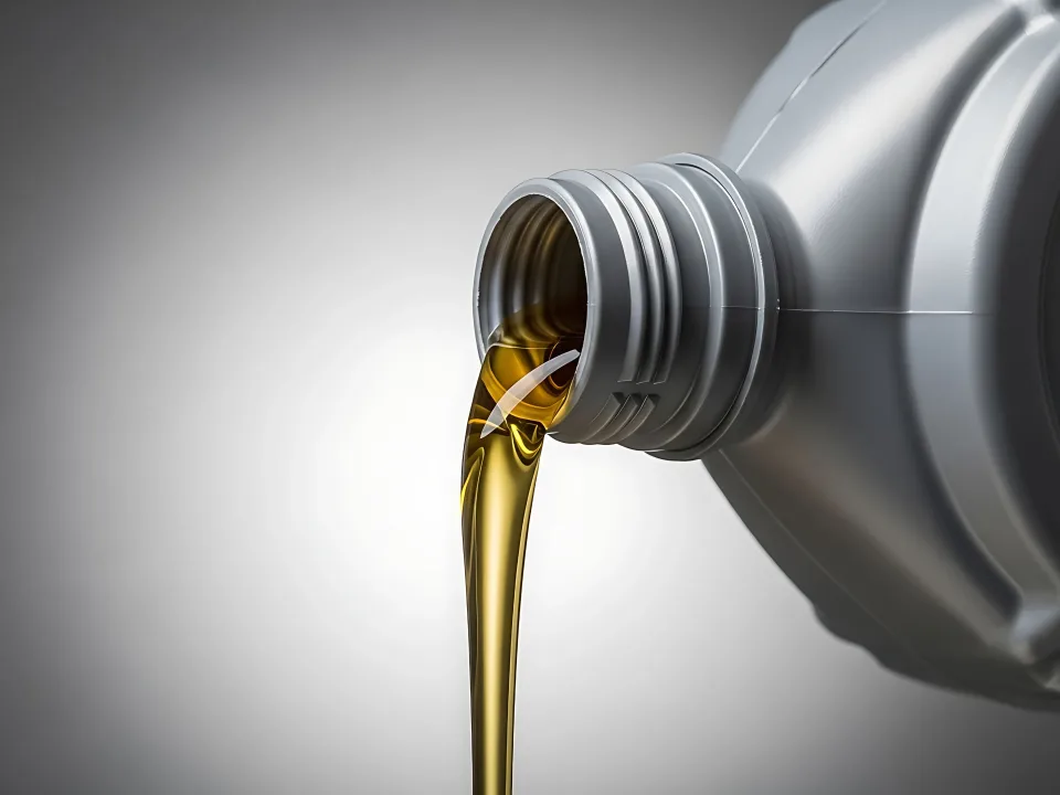 Amber oil being poured from a container