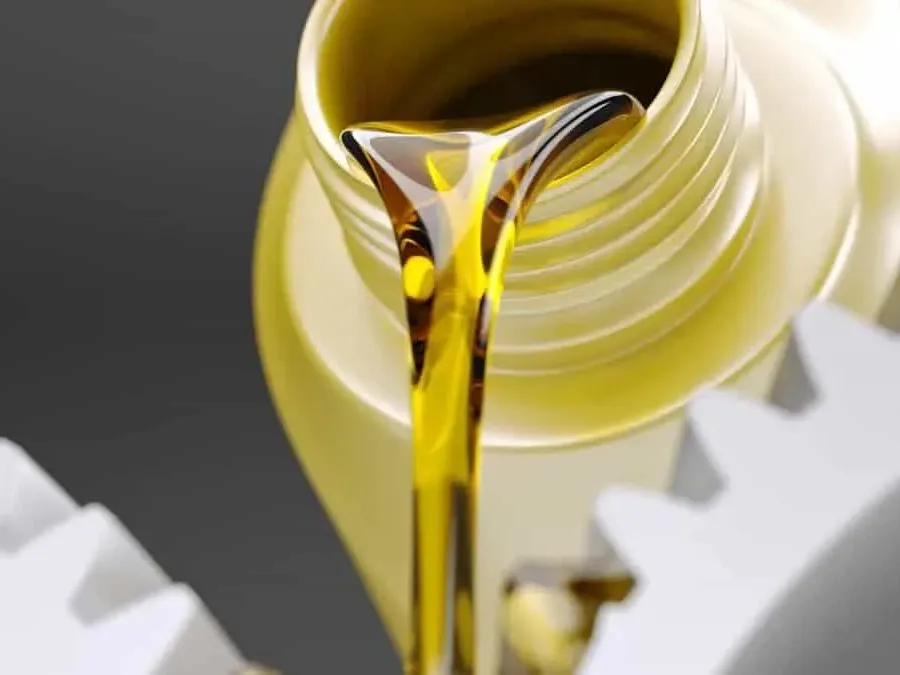 Light oil pouring over machine gears